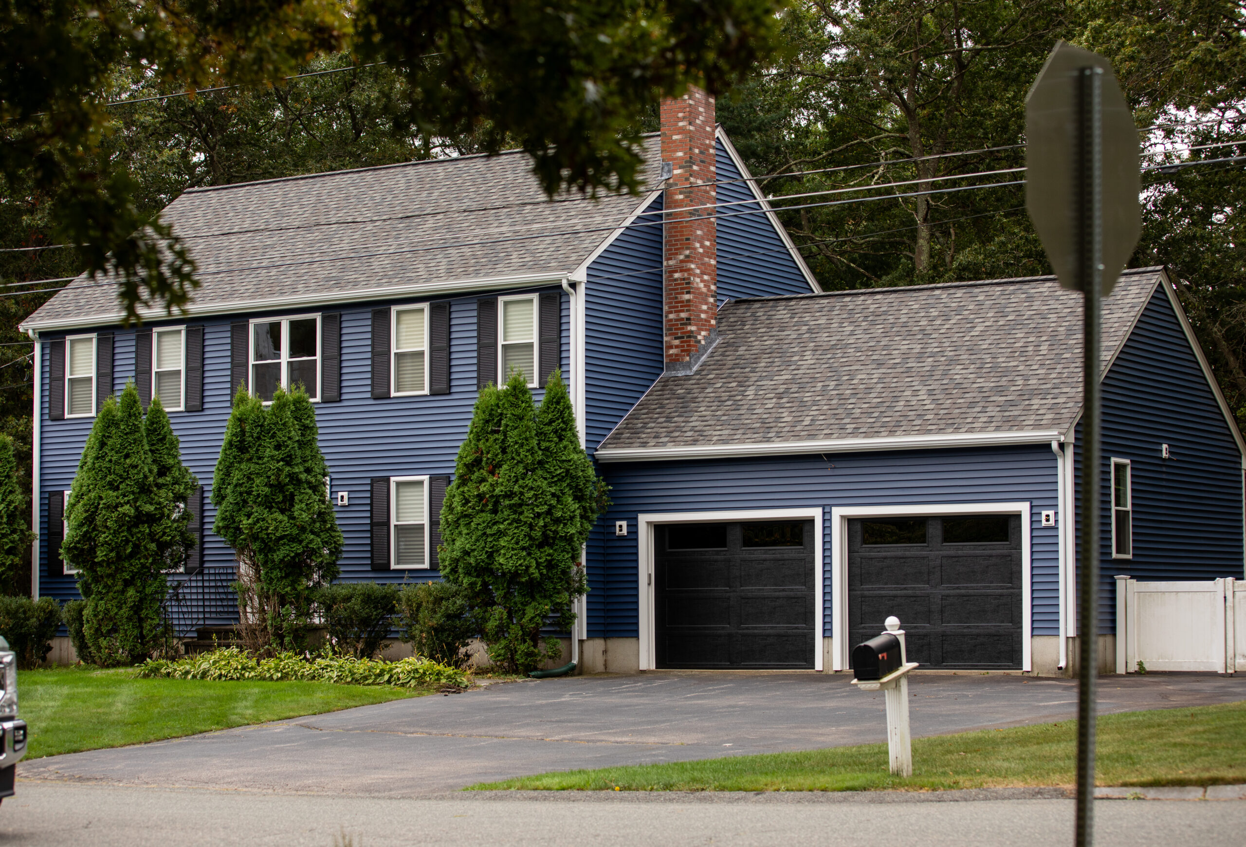 Complete Exterior Renovation in Foxborough, Massachusetts consisting of new roofing, siding, windows, entry doors, garage doors, bulkhead egress, and new PVC deck!